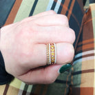 Thin banned ring with a row of diamonds beautifully stacked
