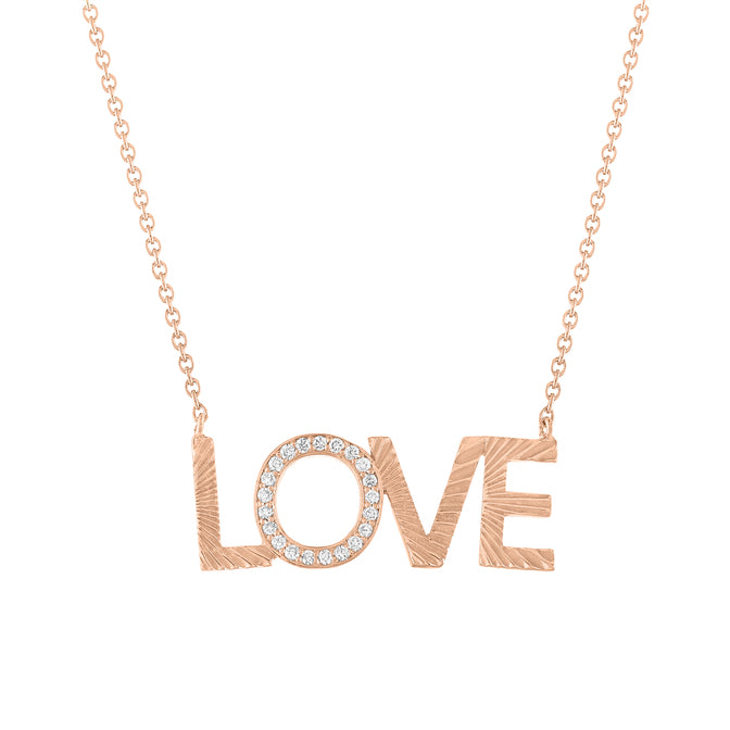 Rose gold love necklace with fluting and round diamonds on the second letter.