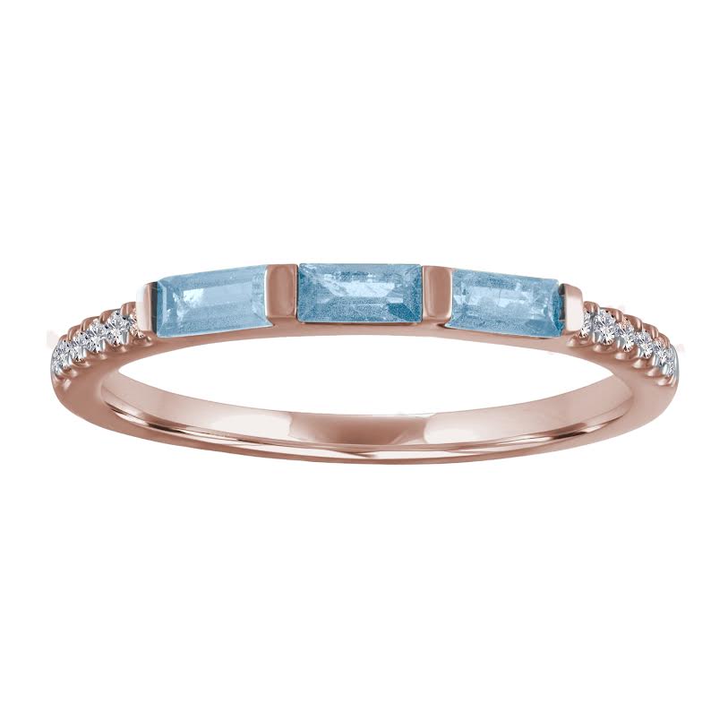 Rose gold skinny band with three aquamarine baguettes and round diamonds on the shank.