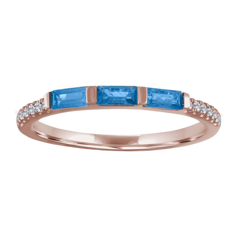 Rose gold skinny band with three blue topaz baguettes and round diamonds on the shank.