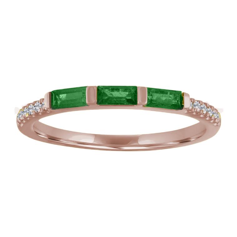 Rose gold skinny band with three emerald baguettes and round diamonds on the shank.
