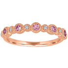 Rose gold skinny band with large round pink tourmalines and small round diamonds.