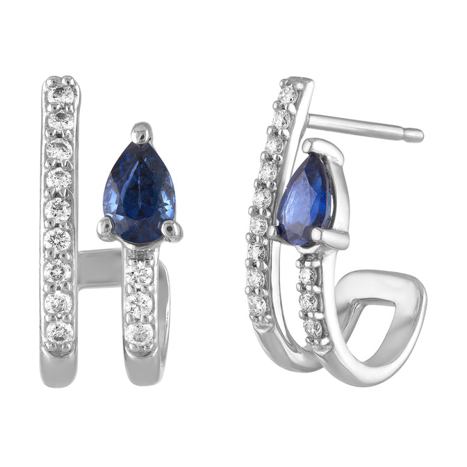 White gold pair of huggies with a pear shaped sapphire and round diamonds.
