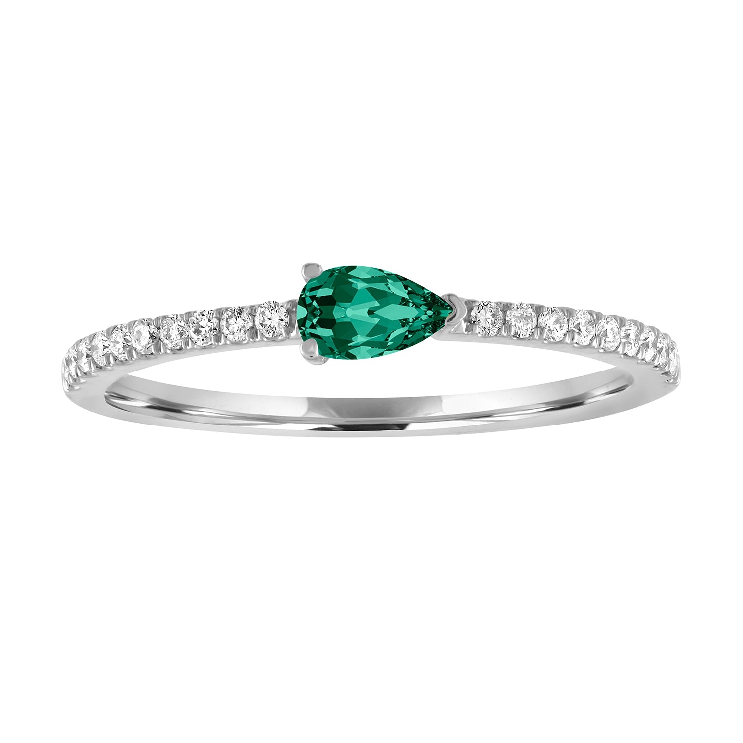 White gold skinny band with a pear shaped emerald in the center and round diamonds on the shank.