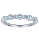 White gold skinny band with large round aquamarines and small round diamonds.