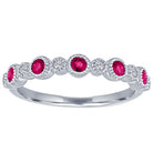 White gold skinny band with large round rubies and small round diamonds.