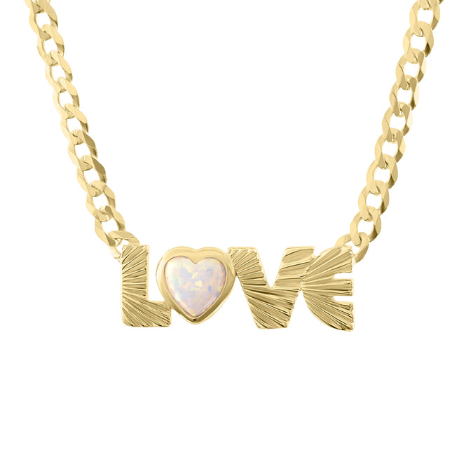 Yellow gold fluted love necklace with a cuban link chain and a heart shaped opal.