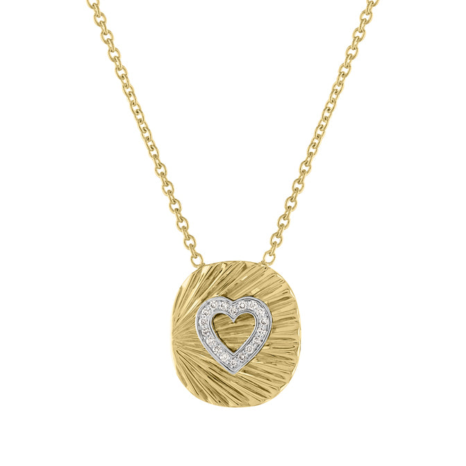 Yellow gold oval necklace with fluting and a diamond heart in the center.