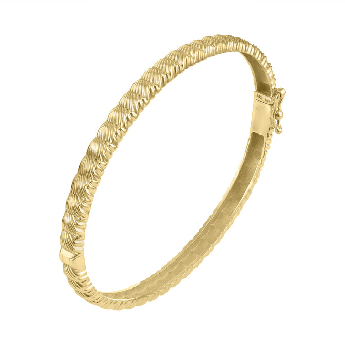 Yellow gold fluted thin bangle.