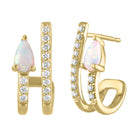 Yellow gold pair of huggies with a pear shaped opal and round diamonds.