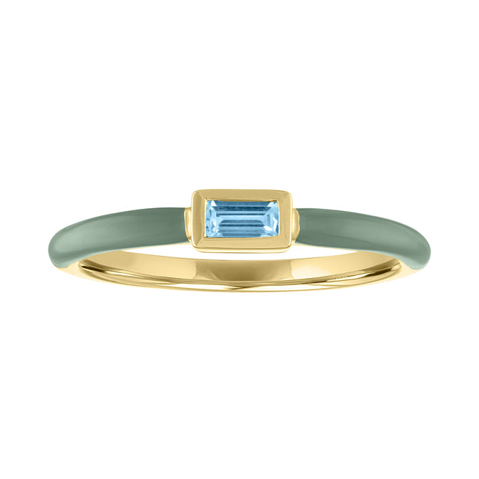 Yellow gold skinny band with pebble enamel and aquamarine bezeled baguette in the center.