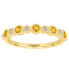Yellow gold skinny band with large round citrines and small round diamonds.