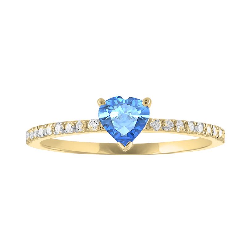 Thin banned yellow gold ring with heart shaped blue topaz and round diamonds on the shank
