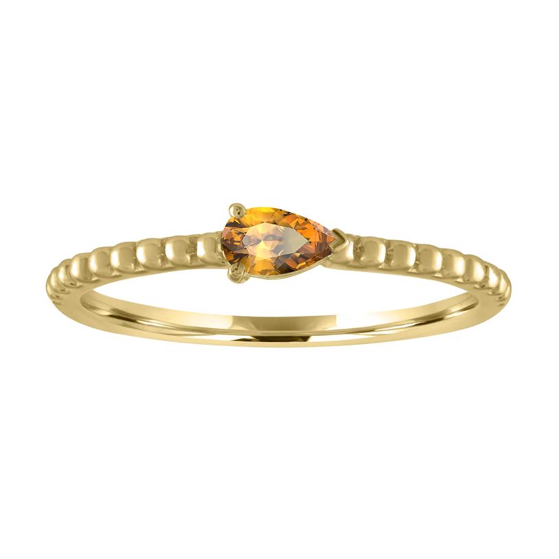 Yellow gold beaded skinny band with a pear shaped citrine in the center. 