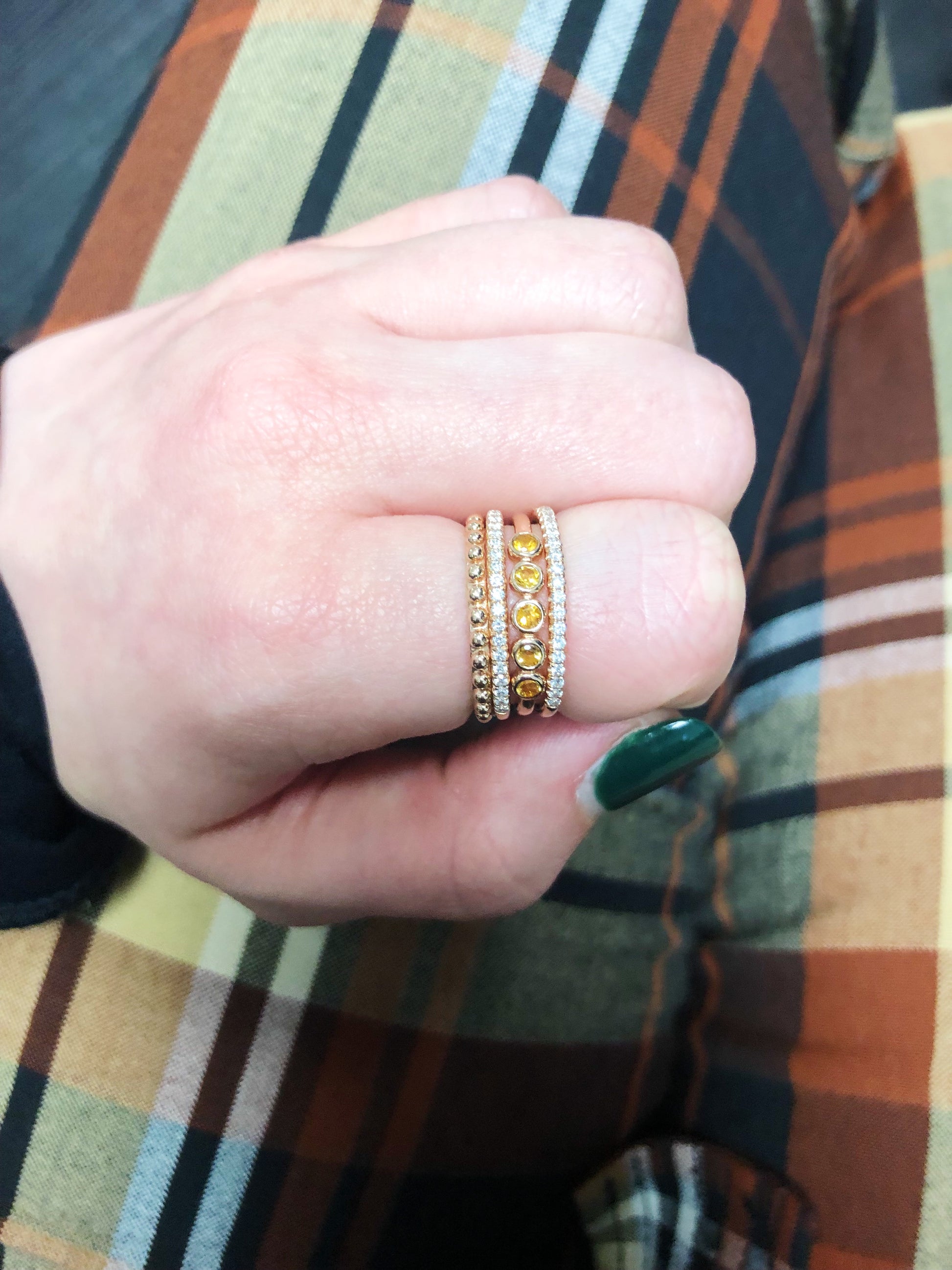 Thin banned ring with a row of diamonds beautifully stacked