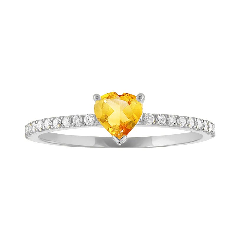 Thin banned white gold ring with heart shaped citrine and round diamonds on the shank