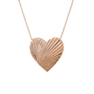 Rose gold fluted heart necklace.