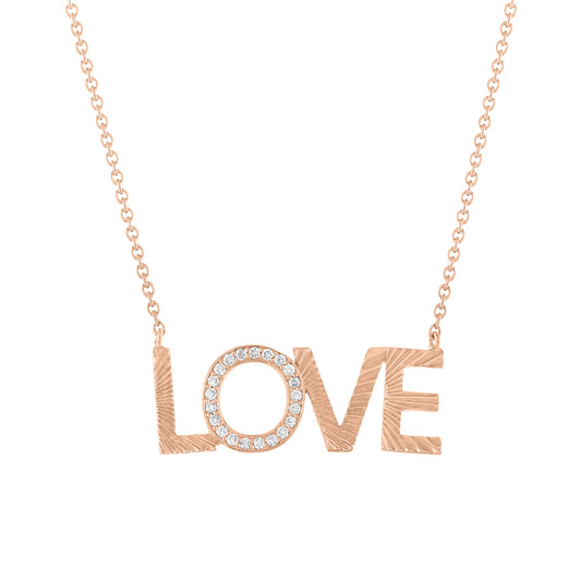 Rose gold love necklace with fluting and round diamonds on the second letter. 
