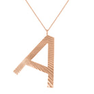 Rose gold large initial necklace with fluting.