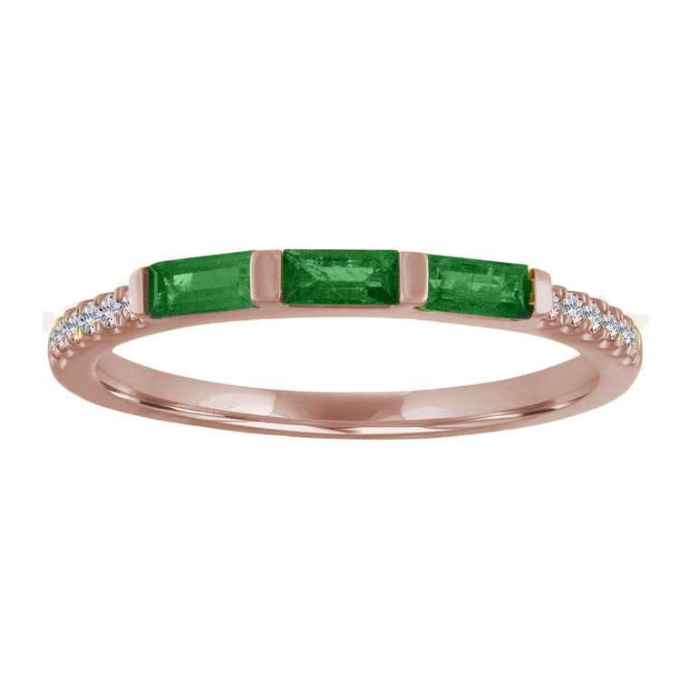 Rose gold skinny band with three emerald baguettes and round diamonds on the shank. 