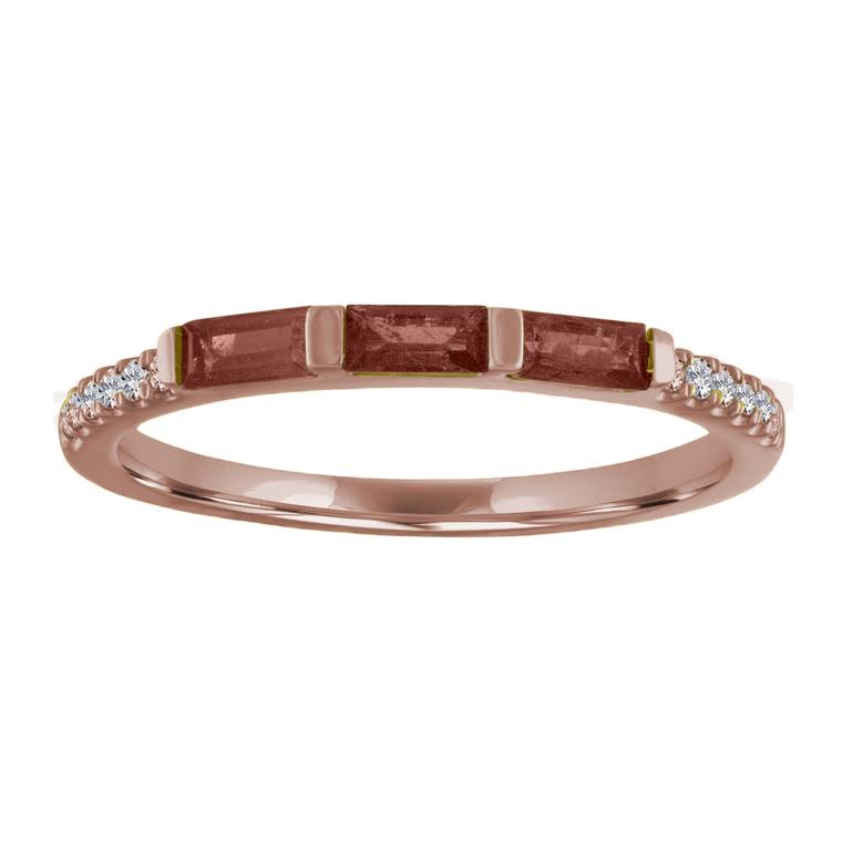 Rose gold skinny band with three garnet baguettes and round diamonds on the shank. 