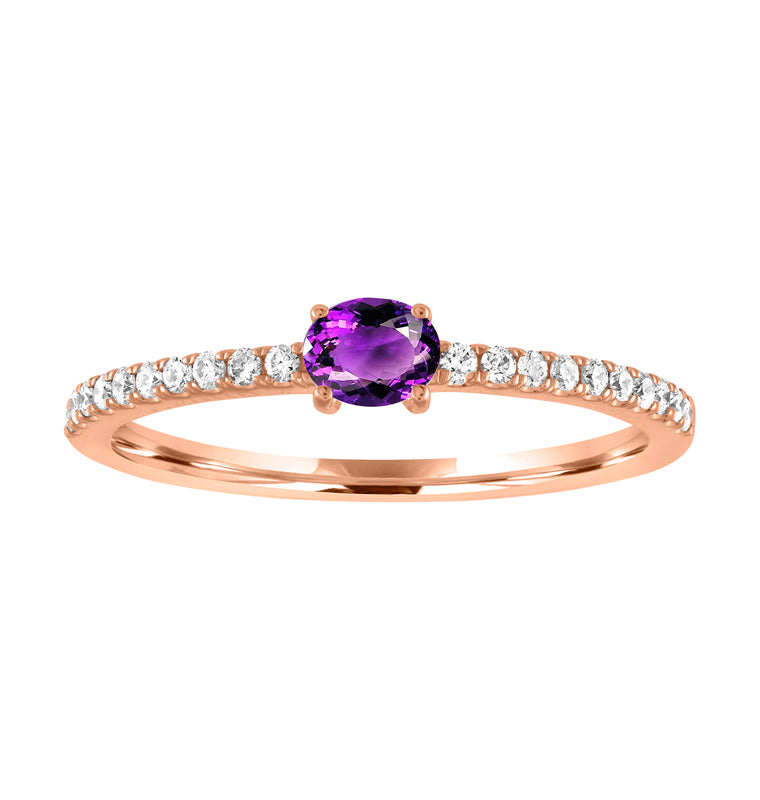 Rose gold skinny band with an oval amethyst in the center and round diamonds along the shank.