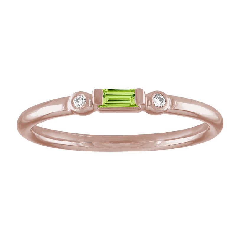 Rose gold skinny band with a peridot baguette in the center and two round diamonds on the side. 