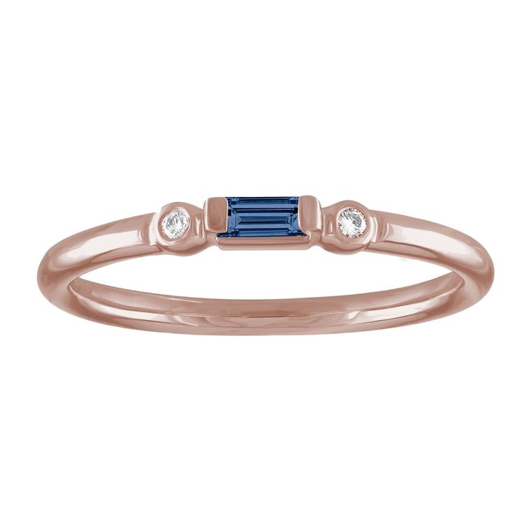 Rose gold skinny band with a sapphire baguette in the center and two round diamonds on the side. 