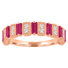 Rose gold wide band with ruby baguettes and round diamonds.