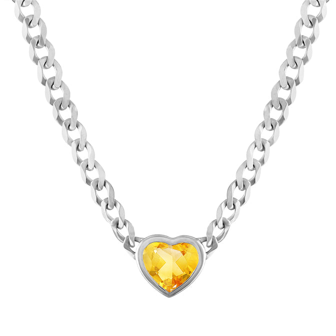 White gold cuban link chain with a heart shaped bezeled citrine in the center. 