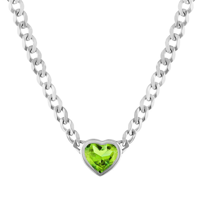 White gold cuban link chain necklace with a heart shaped bezeled peridot in the center. 