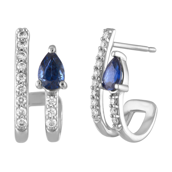 White gold pair of huggies with a pear shaped sapphire and round diamonds. 