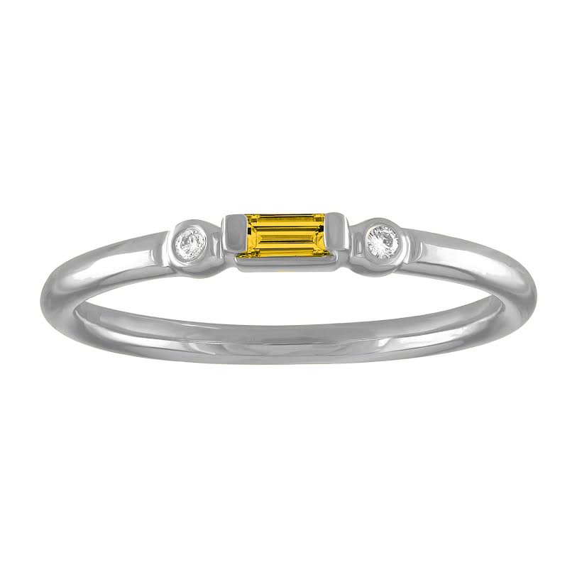 White gold skinny band with a citrine baguette in the center and two round diamonds on the side. 