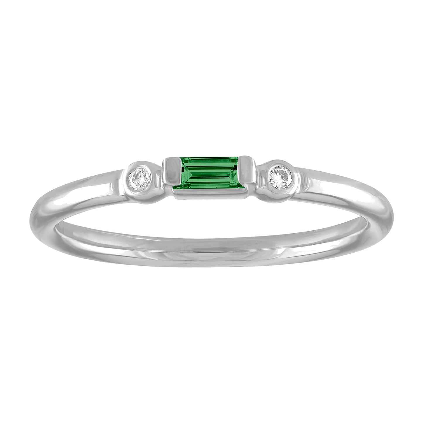 White gold skinny band with an emerald baguette in the center and two round diamonds on the side. 