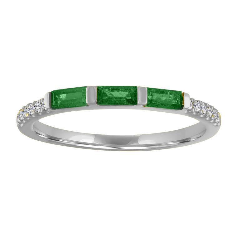 White gold skinny band with three emerald baguettes and round diamonds on the shank. 