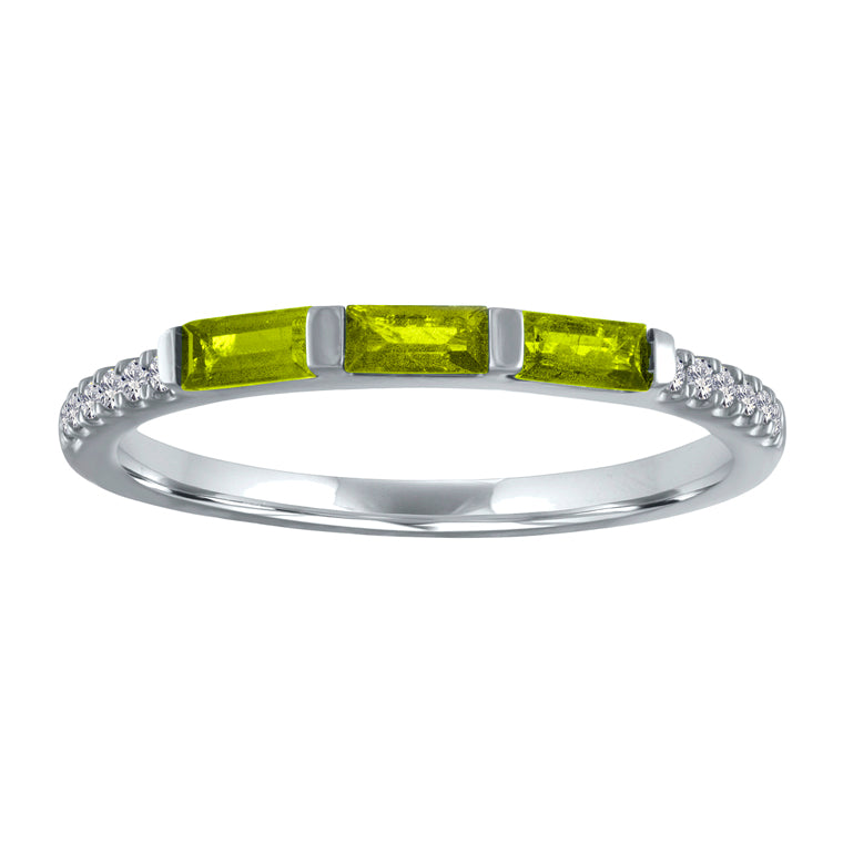 White gold skinny band with three peridot baguettes and round diamonds on the shank.
