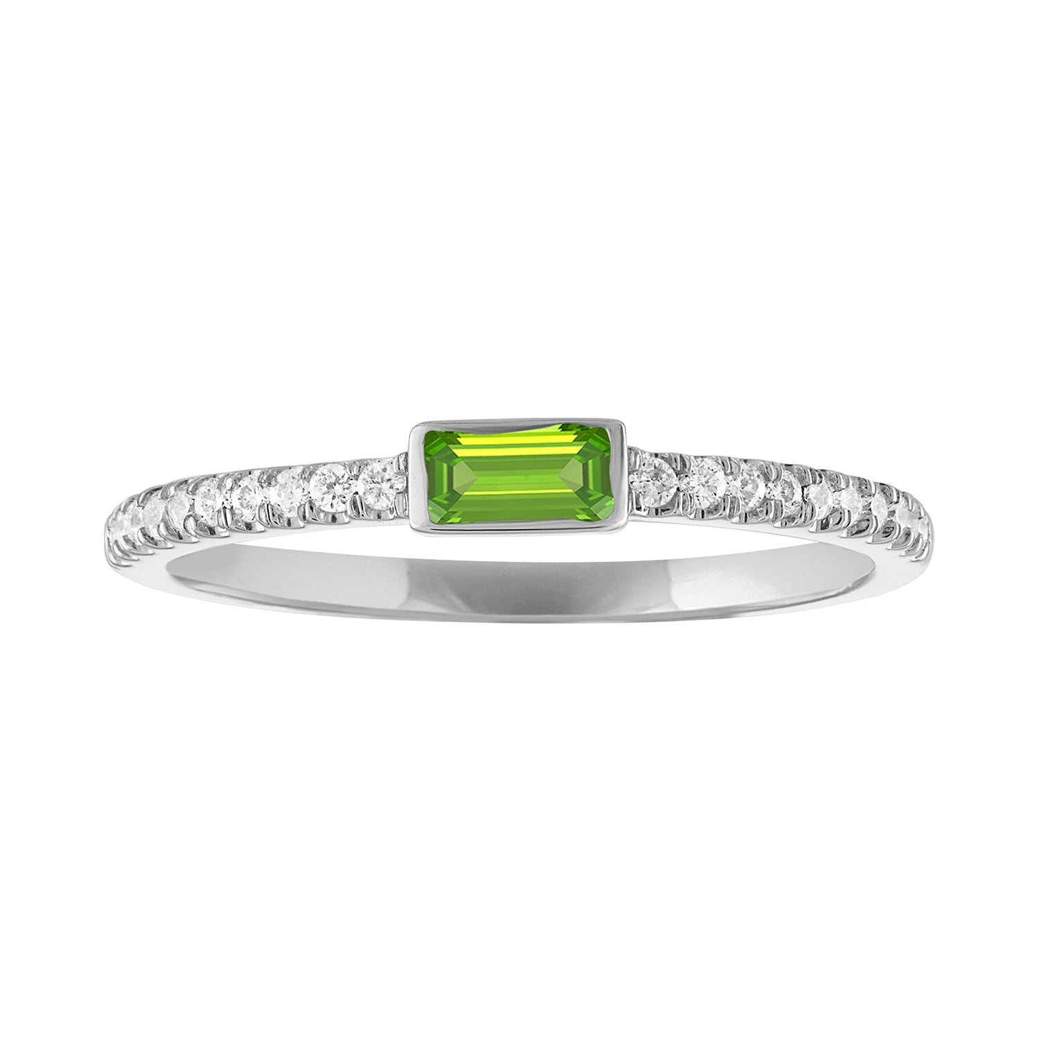 White gold skinny band with a bezeled peridot baguette in the center and round diamonds on the shank. 