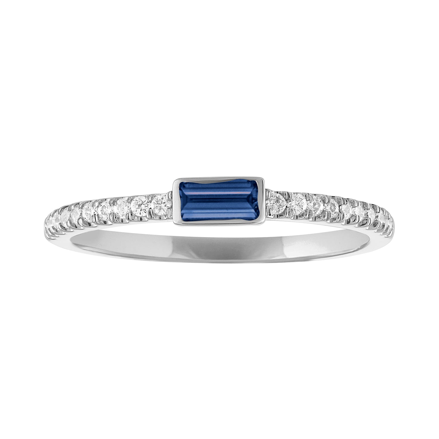 White gold skinny band with a bezeled sapphire baguette in the center and round diamonds on the shank. 