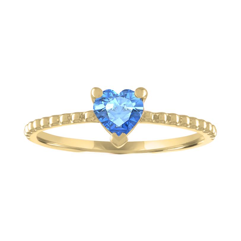Yellow gold beaded skinny band with a heart shaped blue topaz in the center. 