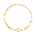 Yellow gold cuban link chain bracelet with a heart shaped bezeled white topaz in the center. 