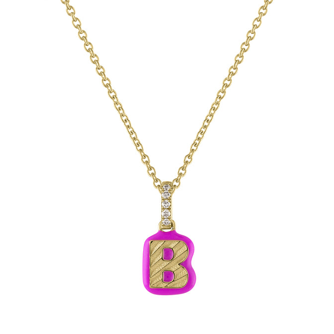 Yellow gold fluted initial charm with pink enamel, a diamond bail and a cable chain.