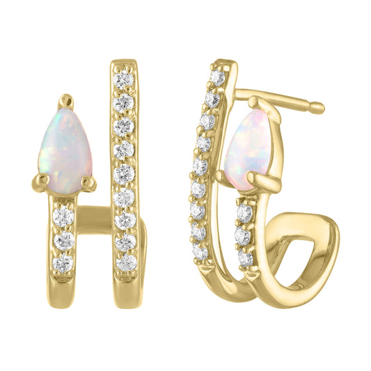 Yellow gold pair of huggies with a pear shaped opal and round diamonds. 