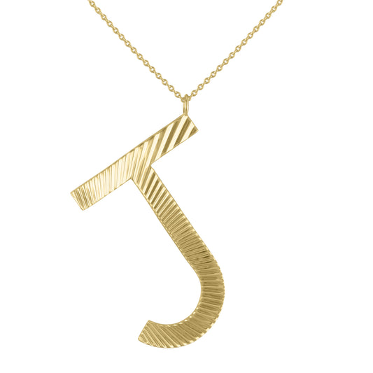 Yellow gold large initial necklace with fluting.