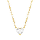 Yellow gold necklace with a white topaz heart in the center. 