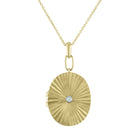 Yellow gold pleated oval locket with a small round opal in the center. 