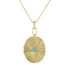 Yellow gold pleated oval locket with a small round turquoise in the center.