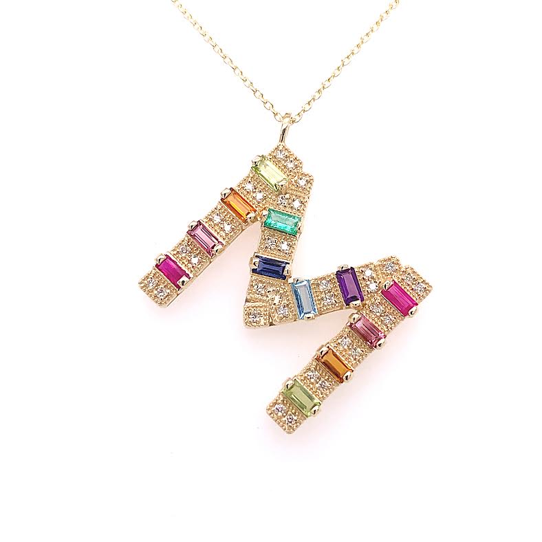 Yellow gold mini initial necklace with multicolor baguettes and round diamonds. 