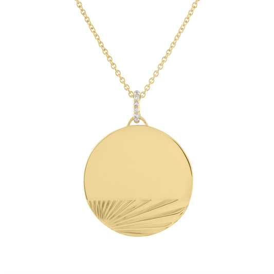 Yellow gold engravable disc necklace with fluting and a diamond bail. 