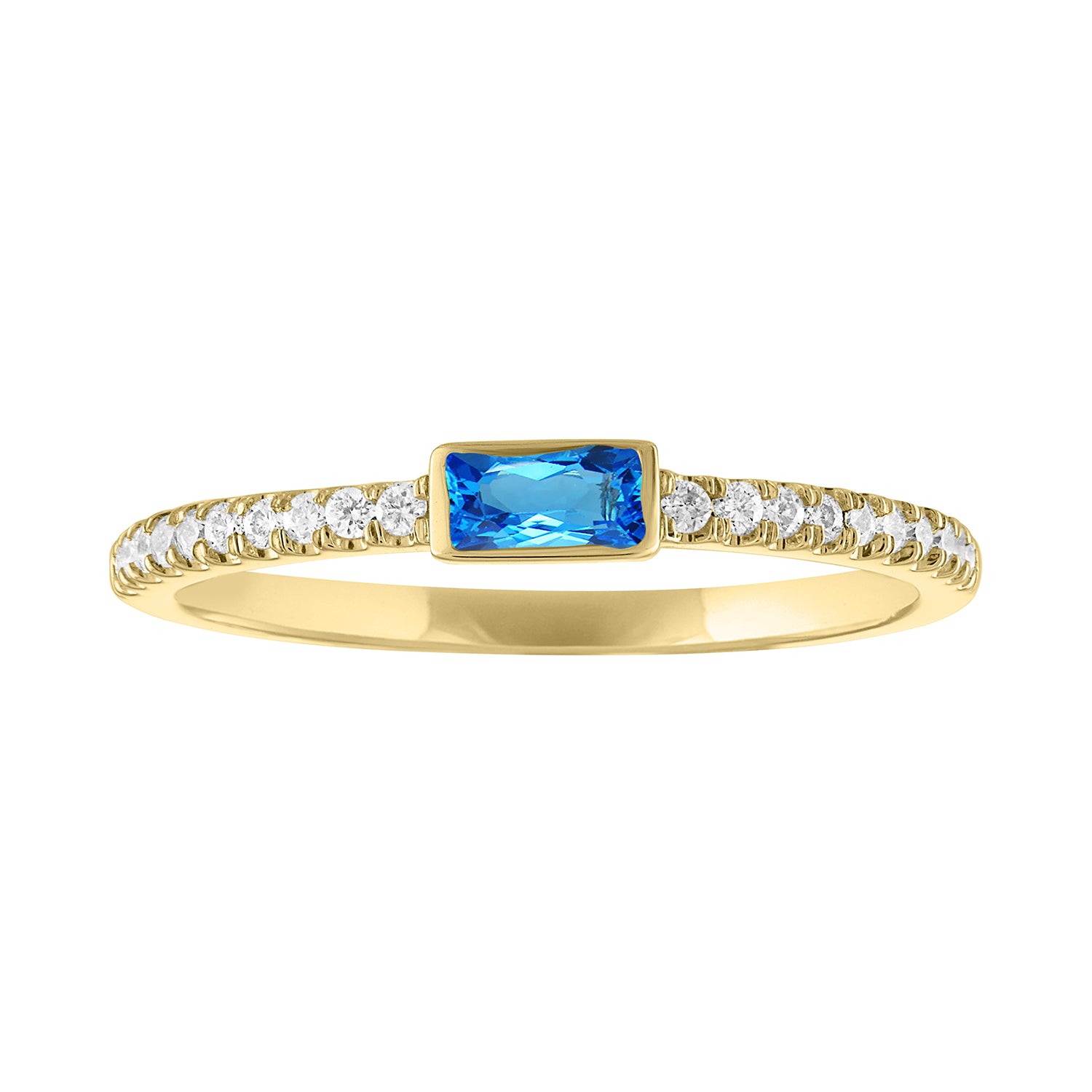 Yellow gold skinny band with a bezeled blue topaz baguette in the center and round diamonds on the shank. 