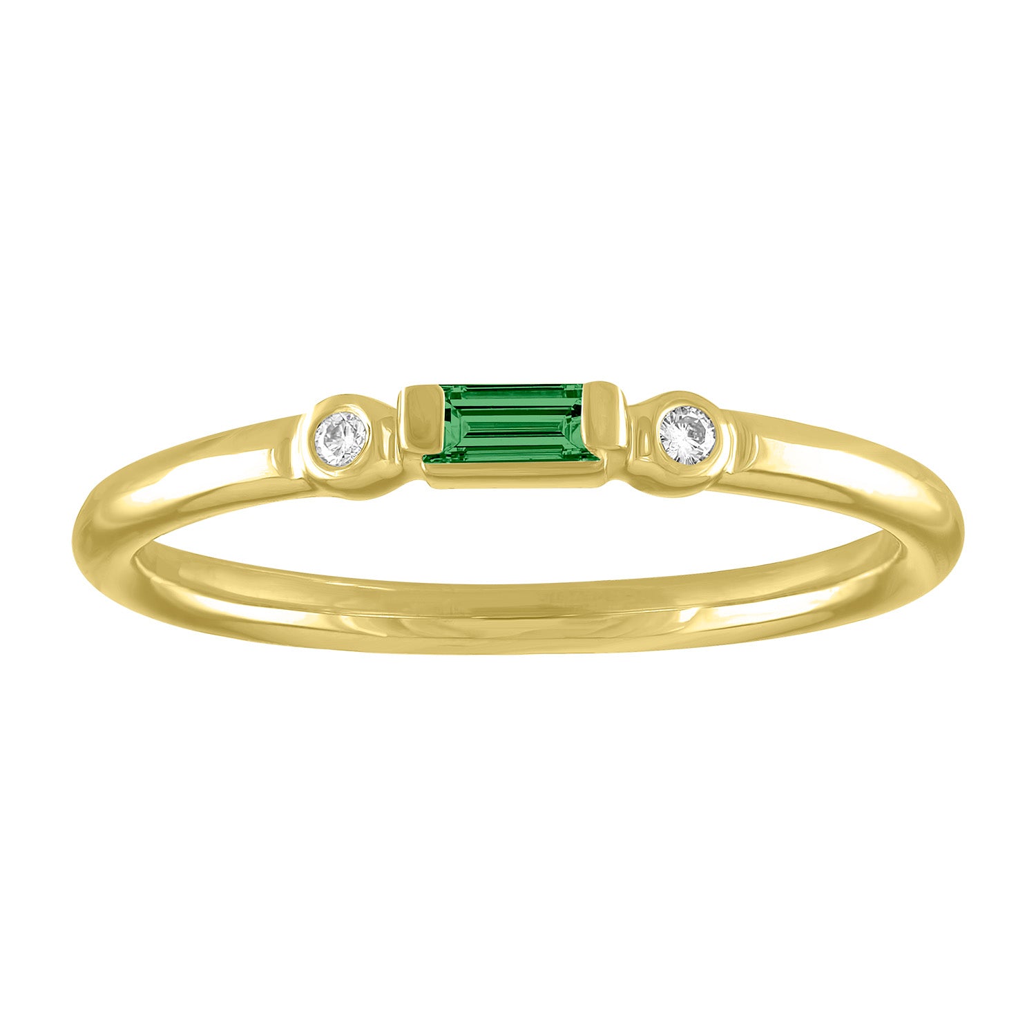 Yellow gold skinny band with an emerald baguette in the center and two round diamonds on the side. 